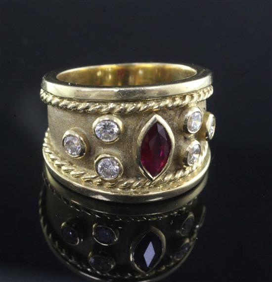 A modern 18ct gold and collet set ruby and diamond dress ring, size P.